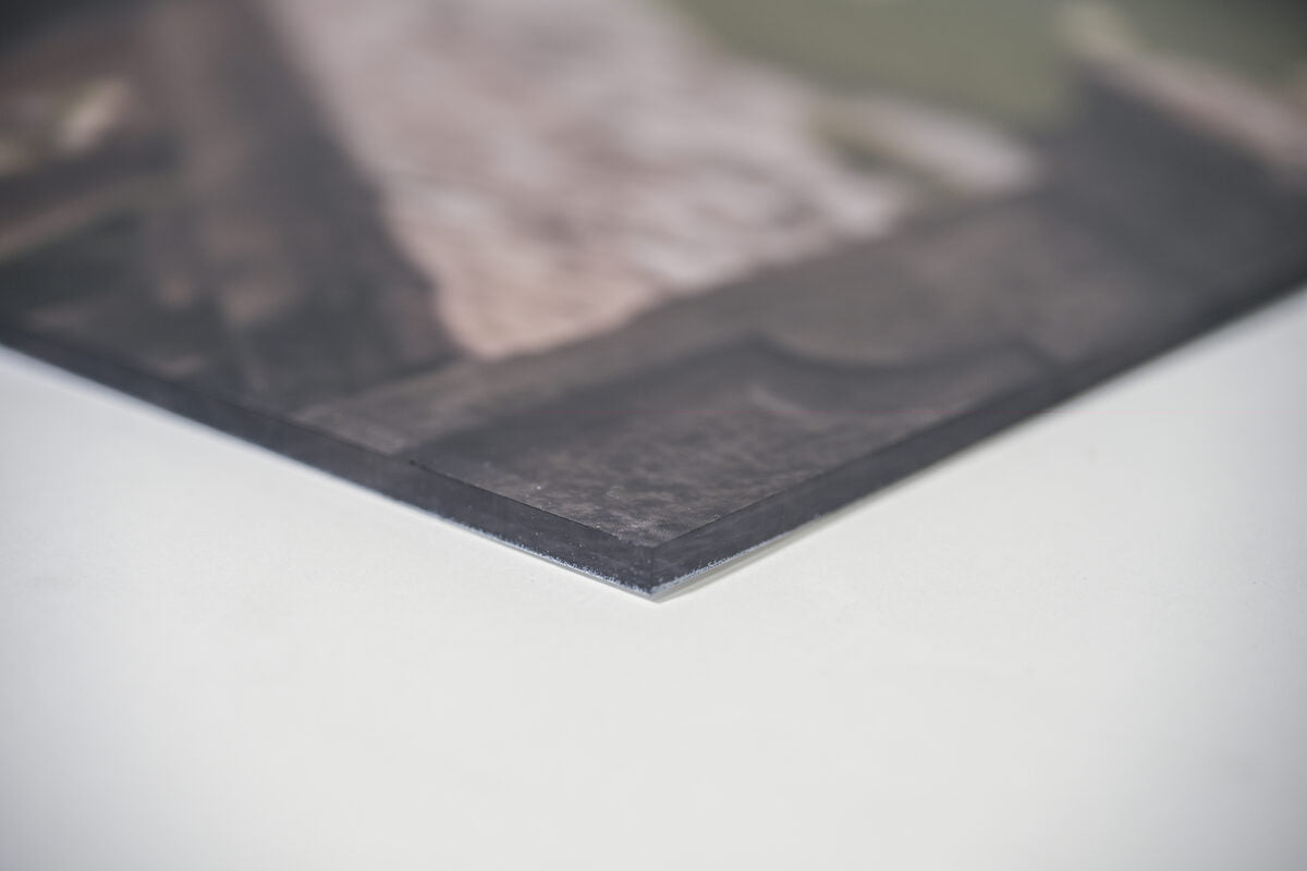The clear beveled edge of an acrylic print