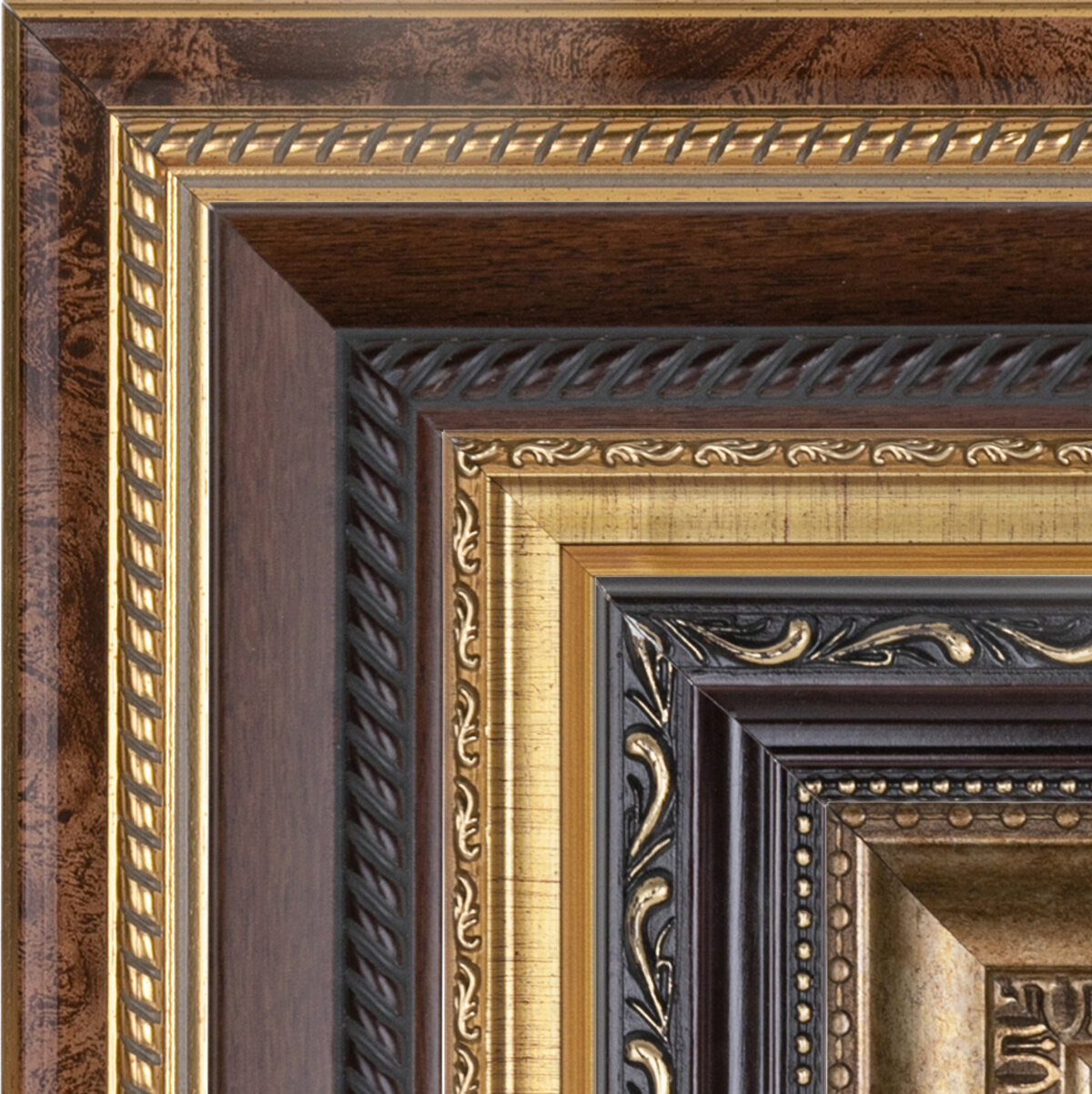 An ornate gold and mahogany frame, close detail of the moulding