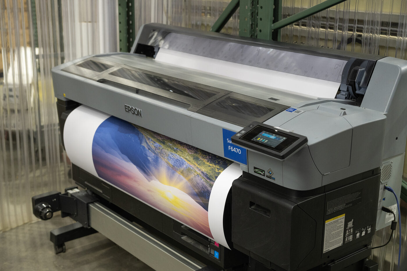 A large-format printer producing a vivid print in our New Jersey factory