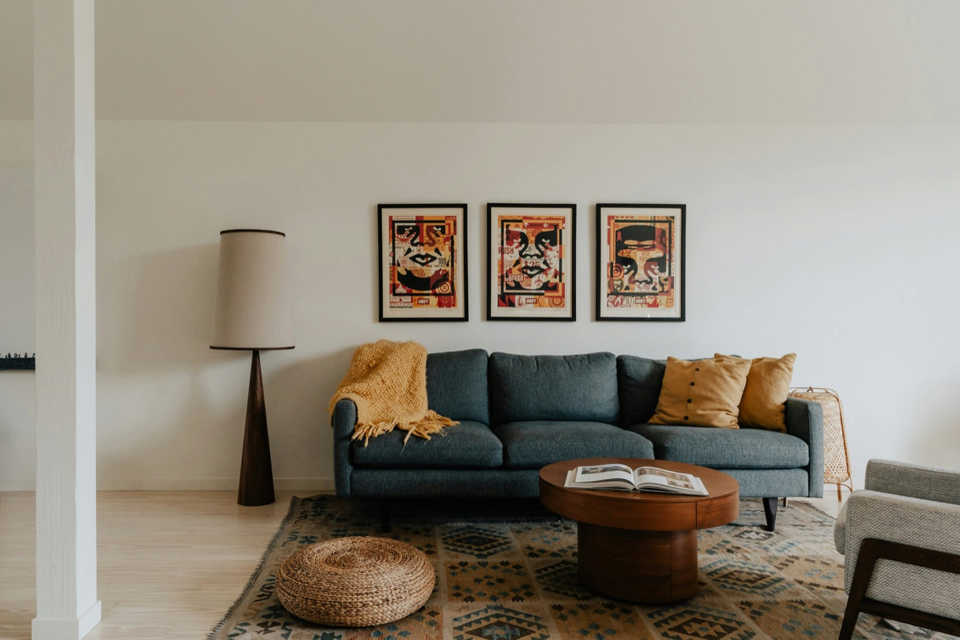 Three framed prints evenly spaced above a sofa