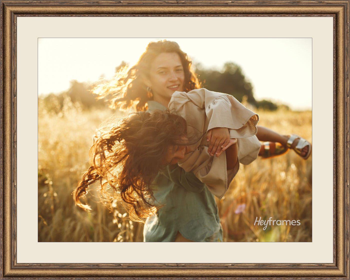 A family's favorite photo in a hand-finished gold frame with mat