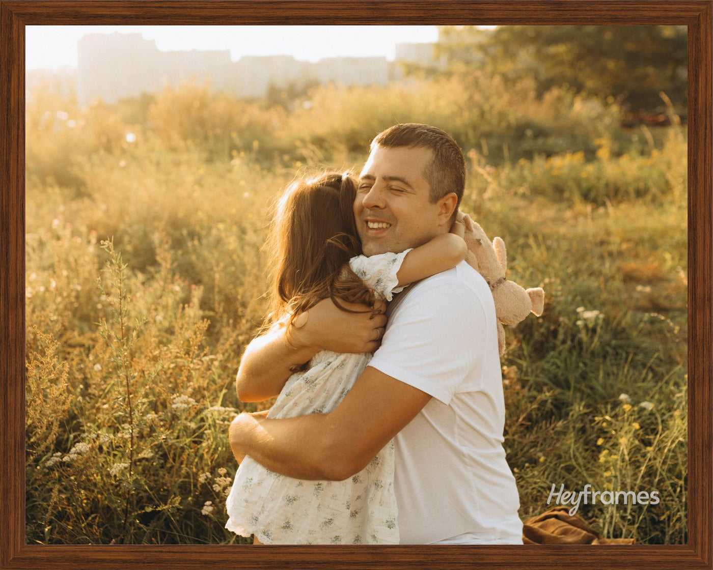 A landscape print in a thin black frame