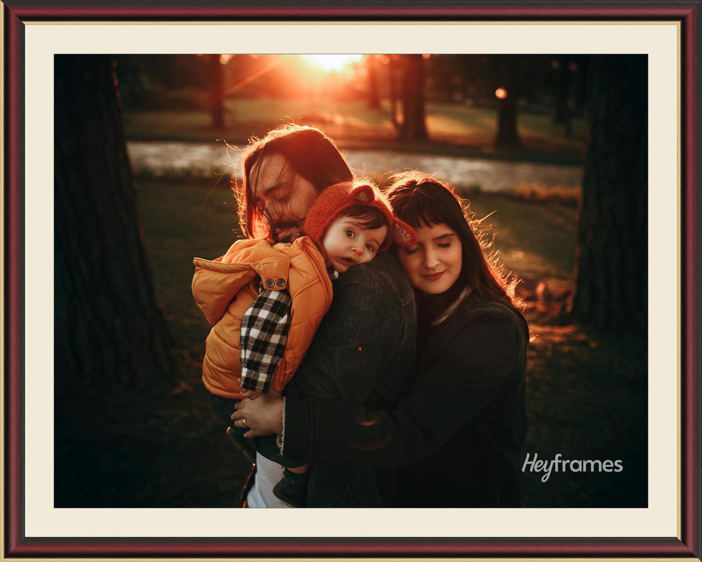 A family photo in a mahogany frame with cream mat